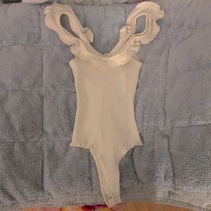 Size Small Onesie with ruffles along the collar